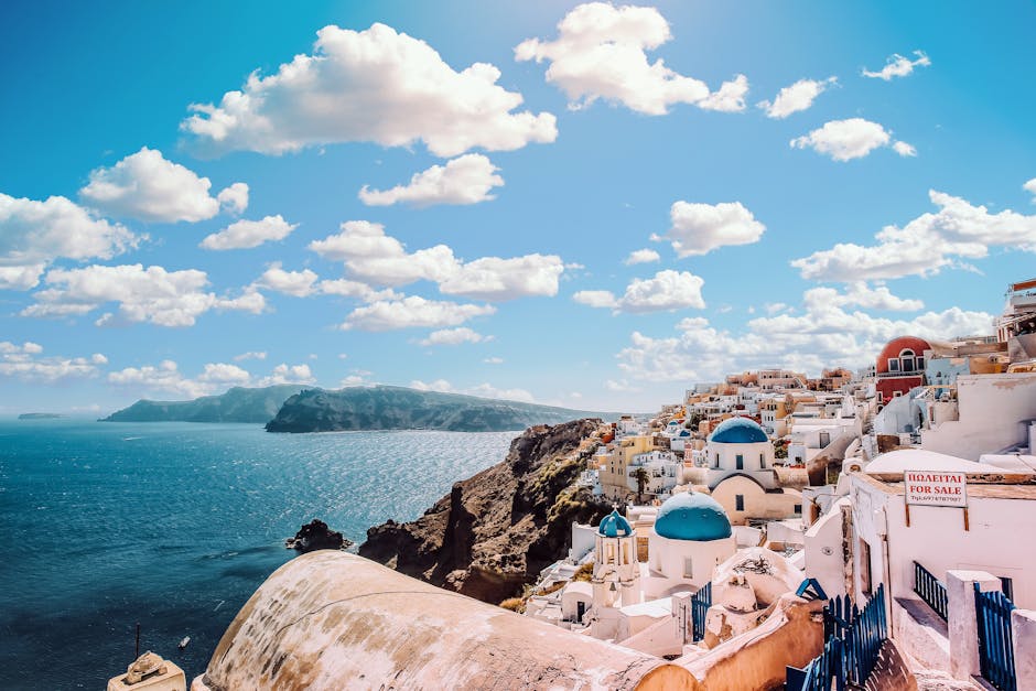 Captivating view of Santorini's famous blue-domed buildings under a vibrant sky